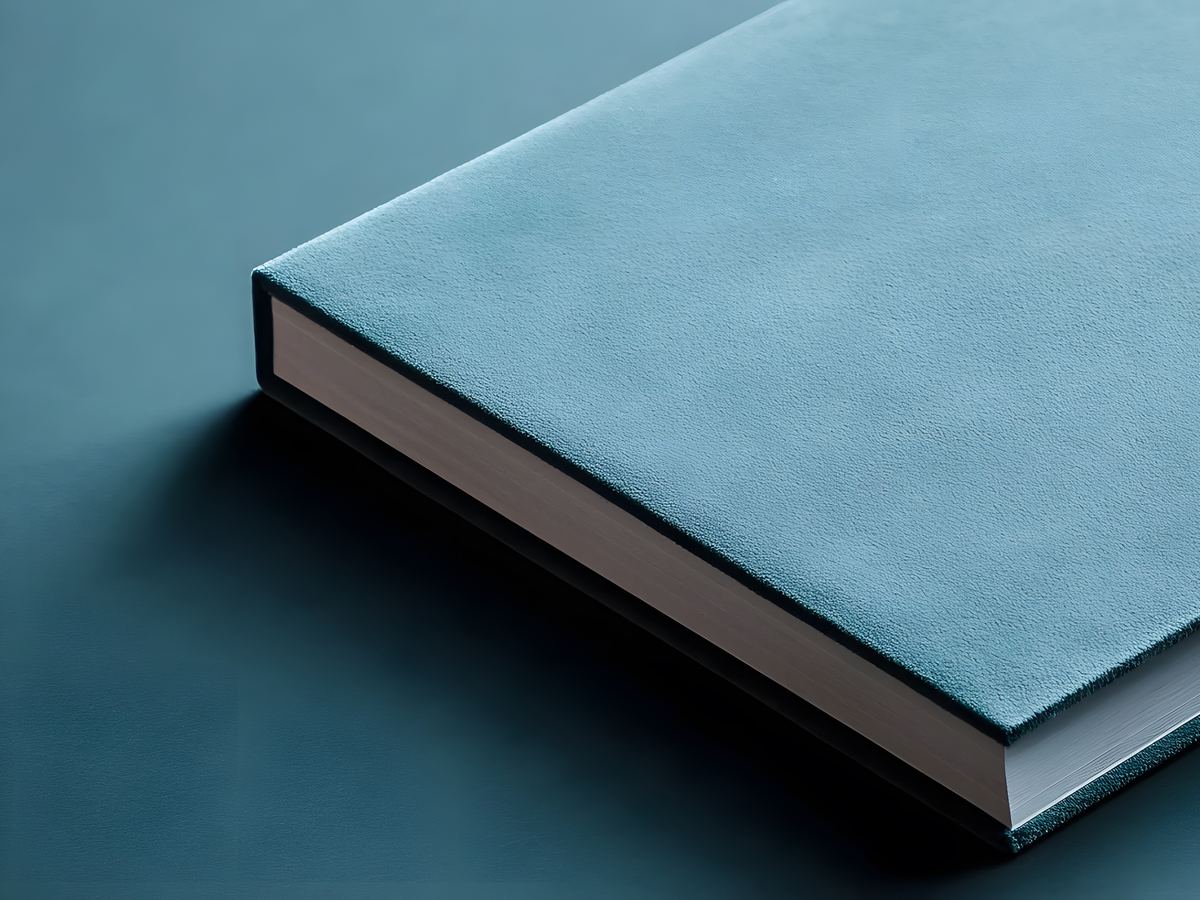 Premium branded notebook with a textured blue cover